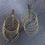 Spinning “vibration” twisted multi hoop earrings - gold tone