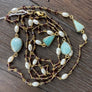 Long beaded gemstone necklace - gold tone