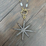White topaz starburst necklace - gold/oxidized silver