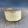 Modern leather cuff bracelet with snakeskin print