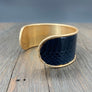 Modern leather cuff bracelet with snakeskin print