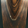 Full moon rising over a mountain range necklace