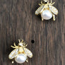 Baby bee stud earrings with faux pearl belly