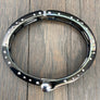 Nailhead accent hinged bangle bracelet - gloss black and chrome