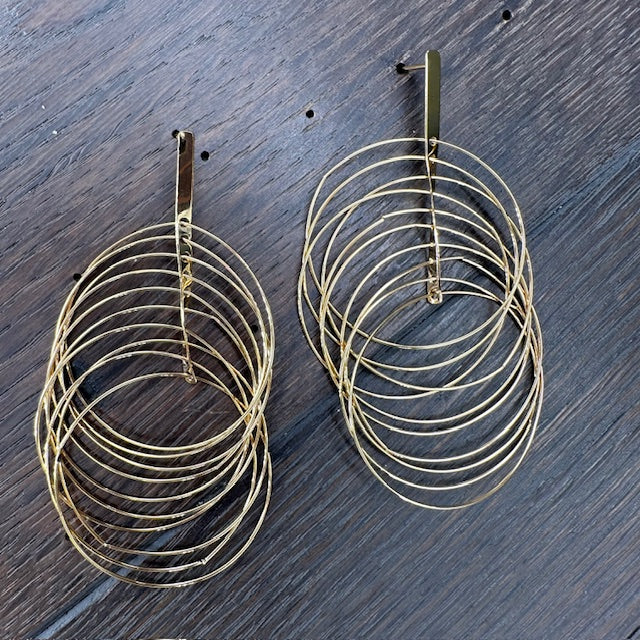 Spinning “vibration” twisted multi hoop earrings - gold tone