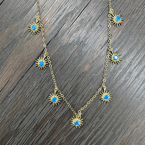 Dangling starburst necklace - gold/blue