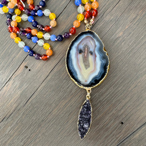 Multi-stone hand knotted necklace with agate slice + druzy pendant
