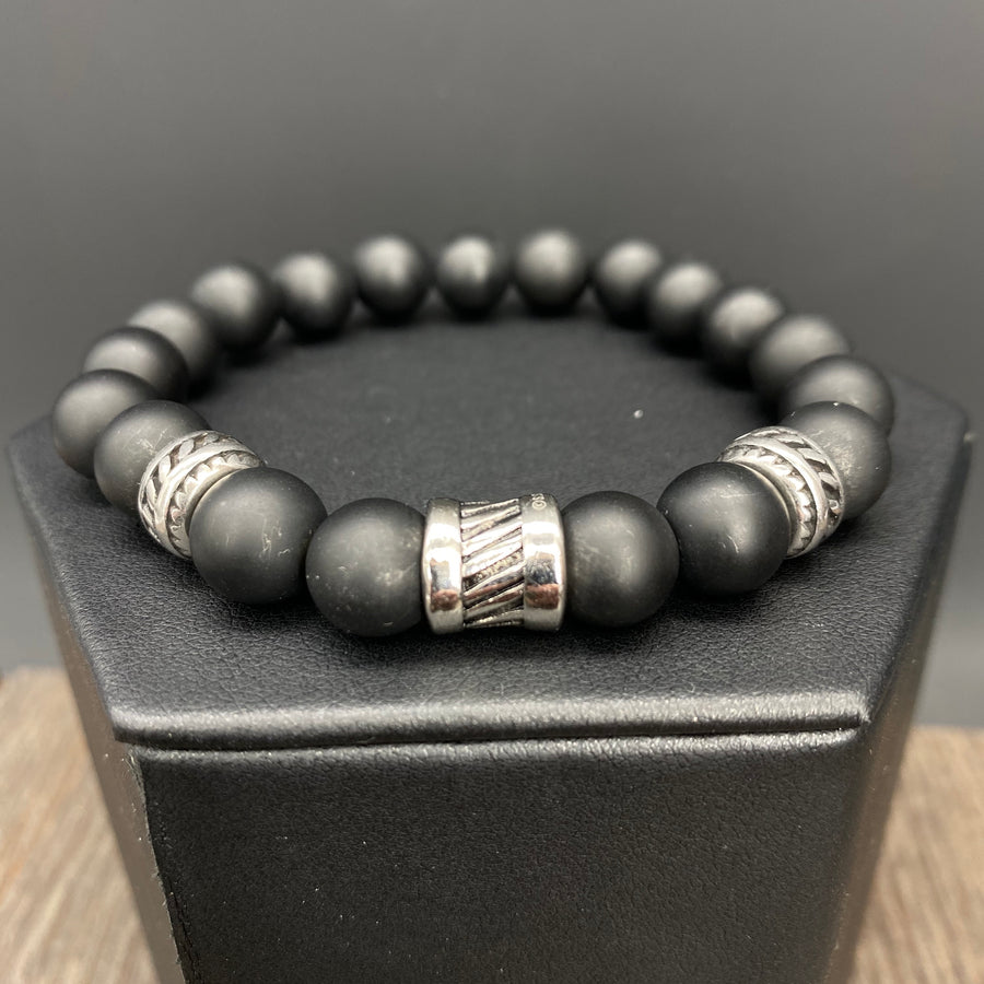 Black bead bracelet with textured accents - silver