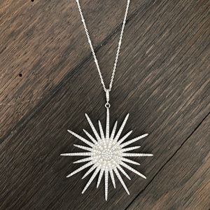 Pavé cz sunburst and tiny star necklace